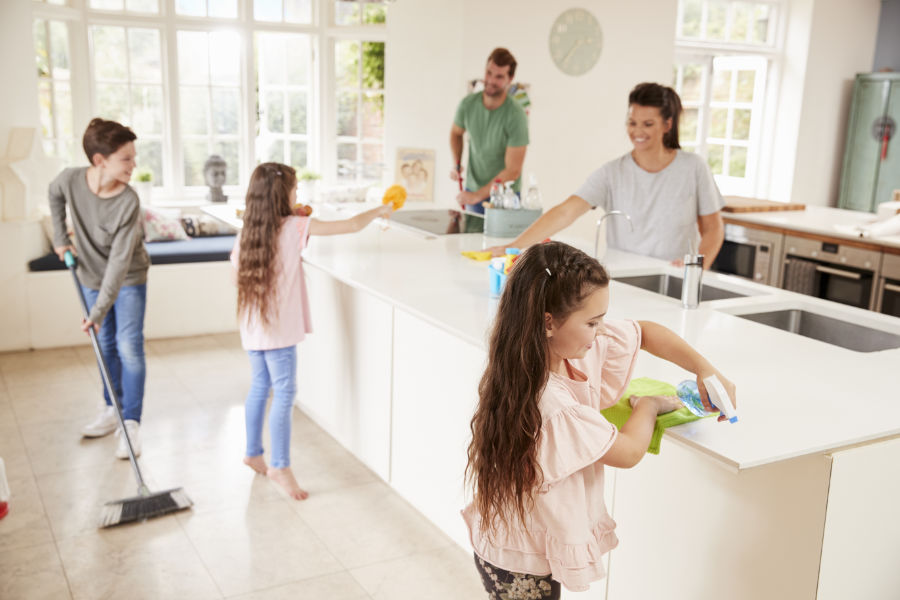 Family cleaning kitchen