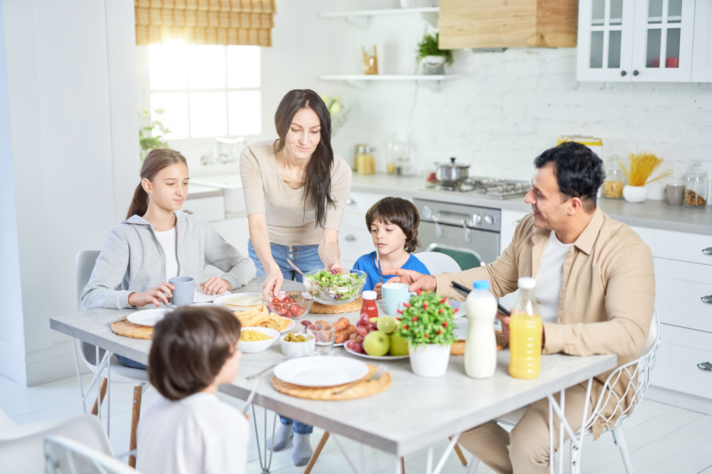 Mom serving food to her family