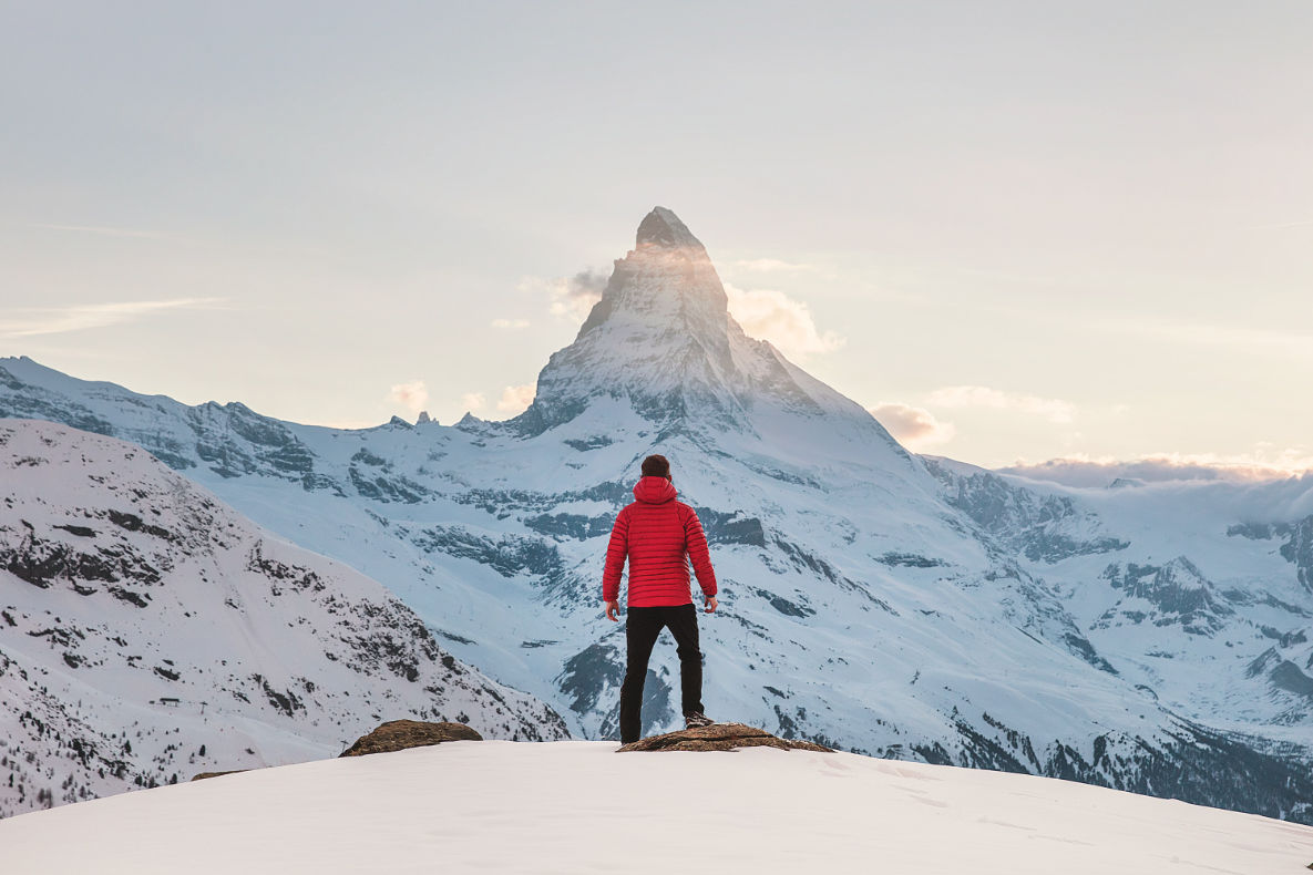 Man Standing Ready to Conquer Mountain