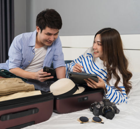 Couple packing a suitcase